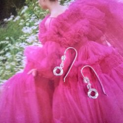 Silver Modern Rose Dangle Earrings by Essemgé - in shiny finish against image of model wearing voluminious hot pink tulle dress