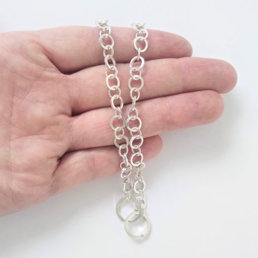 Nought-Chain-Necklace - shown on palm of hand for scale - on white background