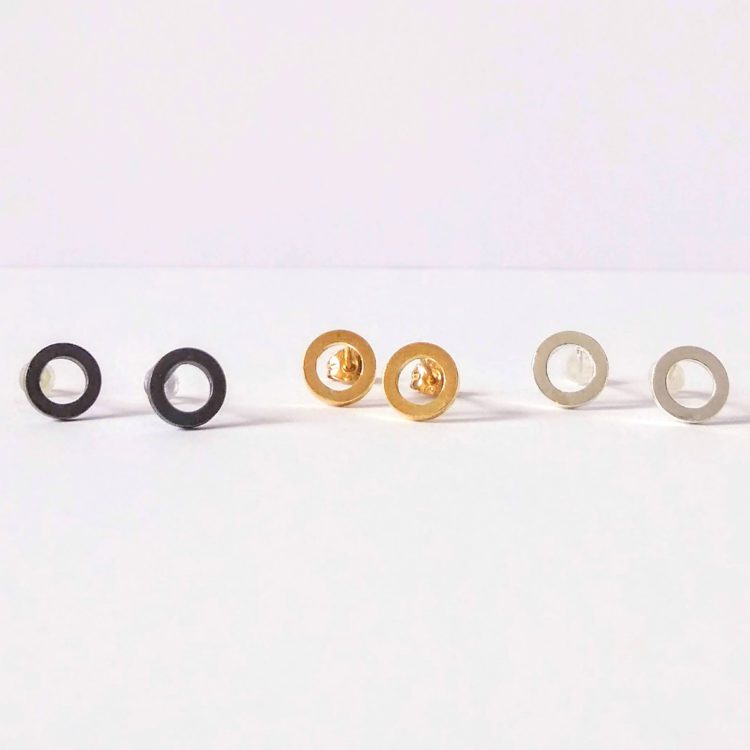 selection of stud earrings in gold and silver - Nought collection by Essemgé - on white background