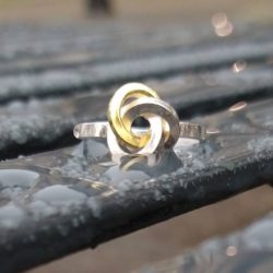 Gold & Silver Graphic Rose Ring - front view -on wet bench