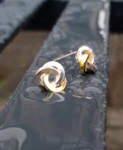 Gold & Silver Graphic Rose Stud Earrings - front view - on wet bench