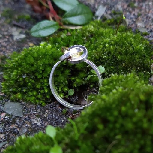 Gold & Silver Graphic Rose Ring - front view - on green moss