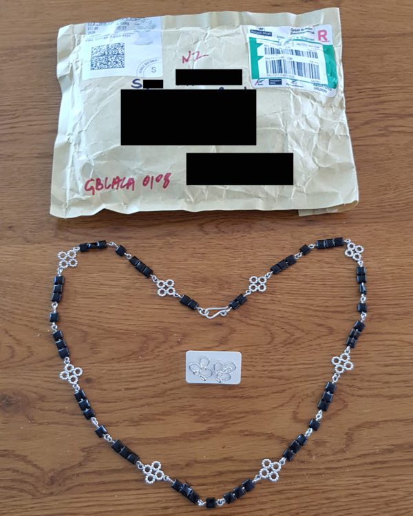Customer feedback - photo sent by client of parcel and jewellery bought