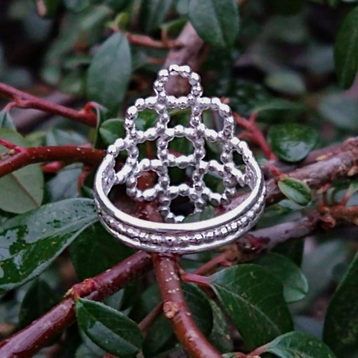 Silver Beaded Quatrefoil Ring - shown from the back so as to see details of the band