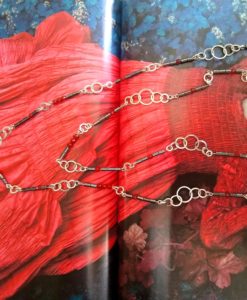 Nought Chain Sautoir Necklace by Essemgé - Bejewelled for Halloween - Silver, Hematite, Carnelian - over background image showing model in red gown