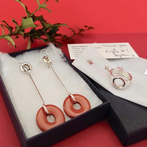 Special Christmas Jewellery Set by Essemgé - Torus Cocktail Earrings and Ring Set - Silver and Red Jasper - in a gift box on seasonal red background with winter greenery