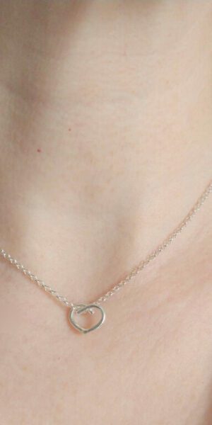 Mini Silver Heart Pendant Necklace by Essemgé - on model