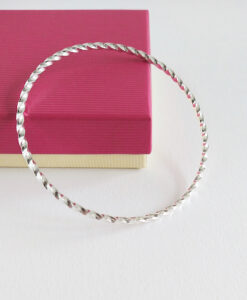 Silver Twisted Square Bangle by Essemgé - against pink gift box
