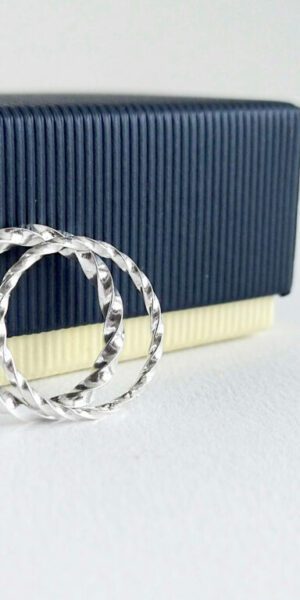 Twisted Square 2-piece stacking rings set by Essemgé - against dark blue gift box