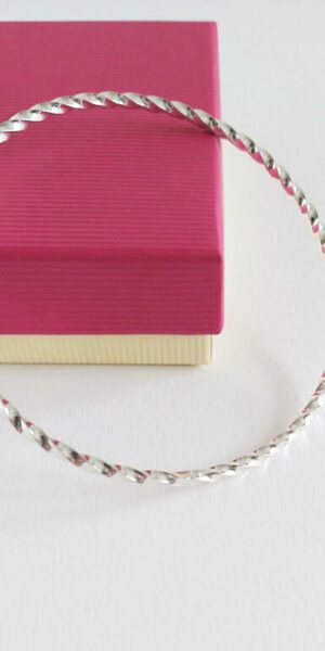Twisted Square bangle by Essemgé - against gift box