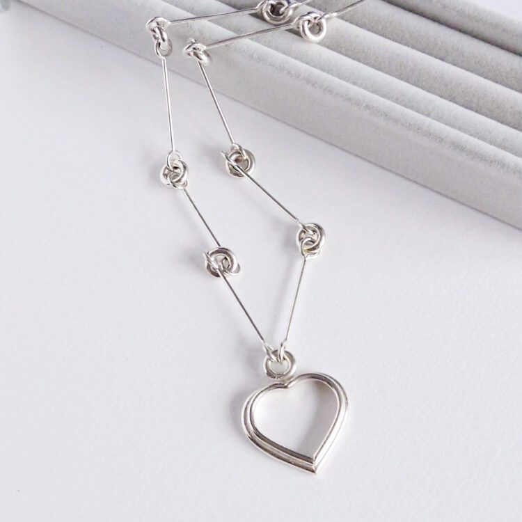 Heart Sautoir by Essemgé - one of a kind piece of jewellery - on grey and white background