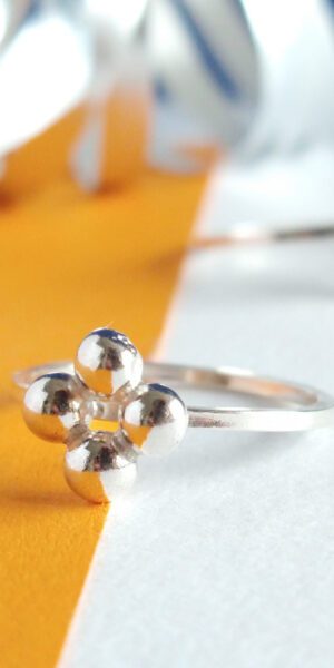 Quatrefoil Caviar Silver Ring by Essemgé - a chic and mindful choice