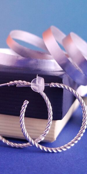 Twisted Rope Hoop Earrings by Essemgé - silver hoops on colourful background