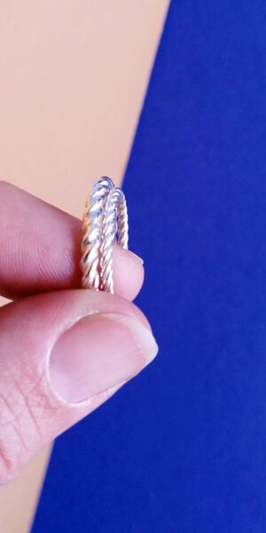 Twisted Rope rings set by Essemgé - silver rings held in hand for scale