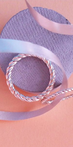 Twisted Rope rings set by Essemgé - silver rings on colour background
