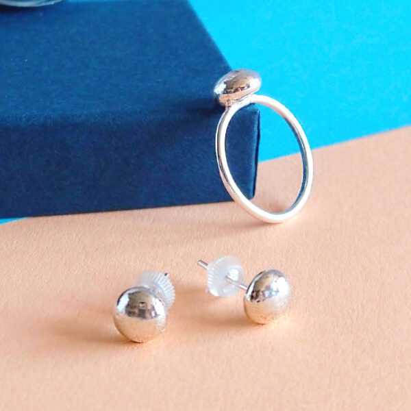 Exclusive Candy Ring and Studs Set by Essemgé- silver ring and studs on colourful background